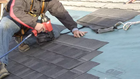 Roofer installing Cambridge Xpress